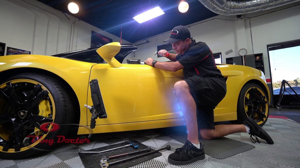 maui ding doctor fixing vehicle dents.