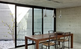 beautiful modern house in cement, interior, wooden dining table
